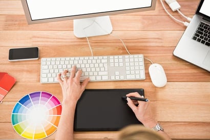 Designer working with digitizer and computer in the office